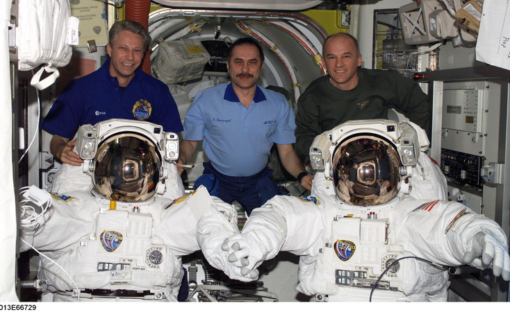 ISS13_with_two_American_spacesuits_in_the_Quest_Airlock.jpg